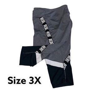 Women’s BeBe Plus Size 3X Side Tape Color Block Capri Leggings Grey/Blac…